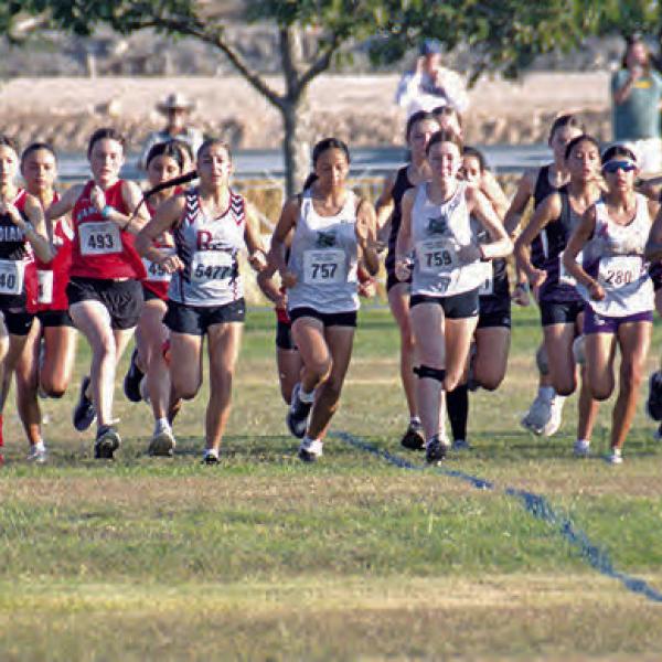 The Hoke McNeil invitational kicks off with Hamilton’s Chaska Down fighting for her lead early. This race contained school and runners from all different walks of Texas, with school sizes ranging from 1A to 6A. Photo by Jennifer Bolton