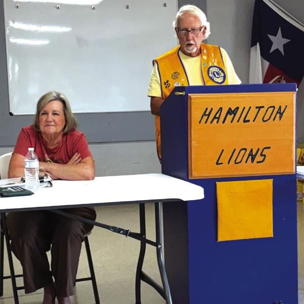 Hamilton Lions Club President Doug Baker and club Treasurer Elaine Baker presented details on recent club projects to members last Wednesday, Sept. 9, at their regular noon meeting. After completing work on the annual shoe drive and Dove Fest projects, the club has plans for more projects and events for the remainder of the year and beyond. Photo by Mark Henry