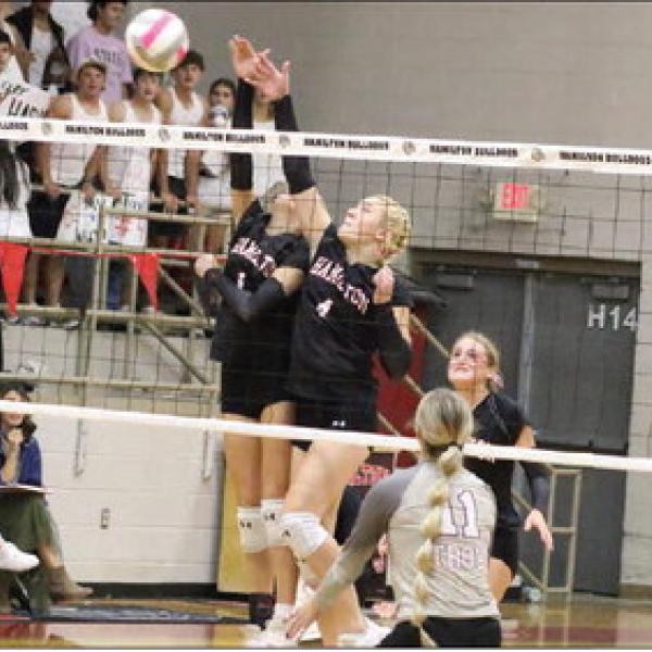 TWO HANDS FOR SAFETY: Landry Gardner and Tayte Haile team up to block a shot from the Troy Lady Trojans. Photo by Jaxon Hansard