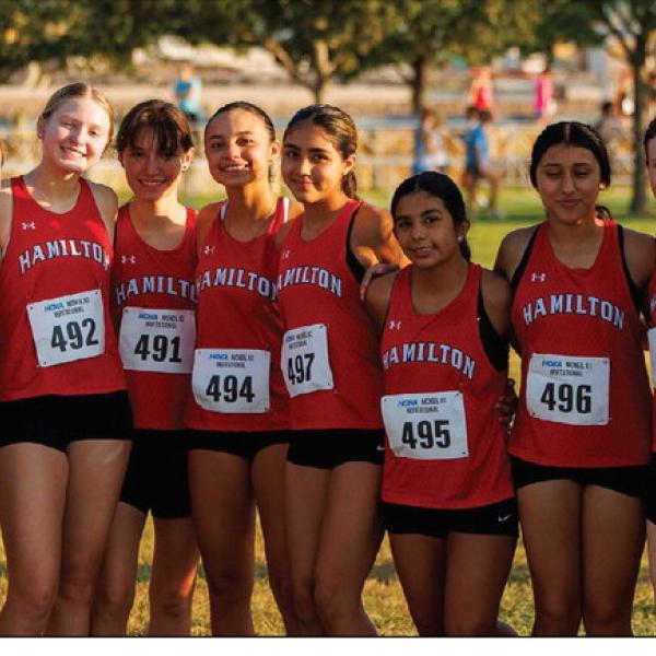 The Bulldogs’ varsity girls team comes together before their big race Oct. 3 at the Lubbock Independent School District Invitational. Jennifer Bolton