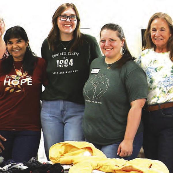 Members of St. John Lutheran Church supported local mothers by helping them to choose infant and toddler essentials and cuddling their little ones at the Resource Boutique and Pop-Up event held at the church last Friday. Pictured left to right: Sandy Layhew, Ivonne Zuniga, Sarah Jones (Choices Clinic), Danielle Ogle, Ramona Reid and Carol Rodriguez. Courtesy photo