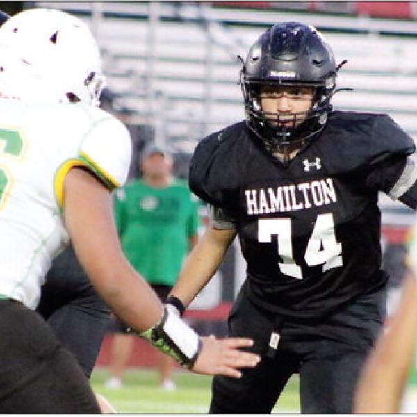 OPEN IT UP: Lineman Javier Silva reads the defensive line and is prepped to make his push to open a gap for the 8th-grade offense in their first win of the season against Dublin 40-0.
