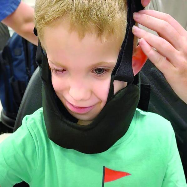 TRYING ON FOR SIZE: David Hardy tried on the second iteration of the brace prior to the 2026 Texas A&amp;M University Engineering Project Showcase. Courtesy of Carolyn Hardy