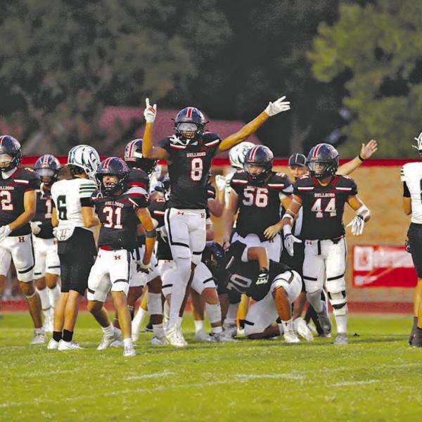 THAT WAY: The Bulldog defense signaling to the crowd and refs that Hamilton has recovered a fumble. Photo by Tracy Cox