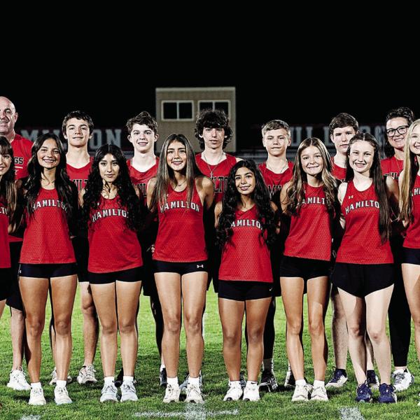 Both Hamilton High School cross-country teams are pictured together above with their coaches. Back row from left: Head cross country coach Brandun Massingill, Elijah Looke, Tristan Gardner, Ryder Zschiesche, Nolan Zschiesche, Michael Grieve and assistant coach Jana Jones. Front row, from left: Berlin Bolton, Lillian Fletcher, Milagros Moncada, Aleena Ramirez, Lila Lozano, Taylyn Banda, Chaska Downs and Carolina DeLaGarza. Picture by Tracy Cox.