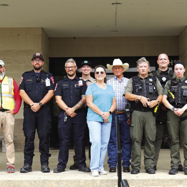 Organized by Chief Deputy Micah Looke (far right) with the Hamilton County Sheriff’s Department, state and local law enforcement, first responders and Hamilton ISD personnel conducted safety training exercises at Hamilton High School last Friday. The joint exercise included Hamilton Emergency Medical Services, Dispatch, HCSO, Texas Game Wardens, Hamilton ISD and representatives from the Texas Education Agency. Photo by Grant Lengefeld