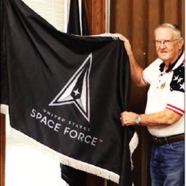 Bob Self, vice commander of Hamilton County American Legion Post 22, presents a U.S. Space Force flag to the Hamilton County Commissioners Court Oct. 13. The flag of the newest military branch will join other patriotic flags displayed in the annex courtroom.