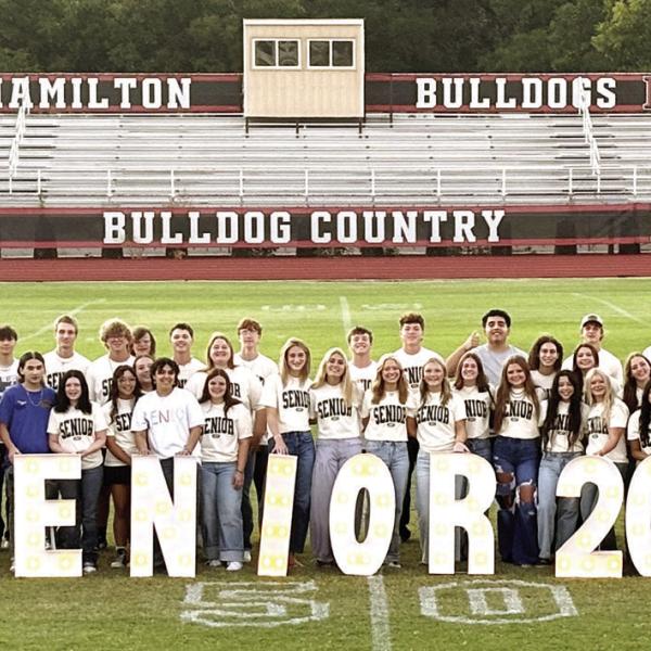 In keeping with a tradition started in 2023 by the then Hamilton High School Class of 2024, Hamilton’s incoming senior Class of 2027 gathered at sunrise last Friday morning at Kooken Field for a time of fellowship and prayer over the upcoming school year. Following a blessing by St. John Lutheran Church Pastor Aaron Kalbas, the HHS seniors spread blankets across the field and enjoyed a picnic-style breakfast prepared and served by their parents. Photo by Grant Lengefeld