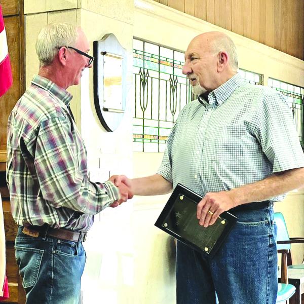 WITH APPRECIATION: Outgoing Mayor Richard Buchanan received a plaque from incoming Mayor Todd Jordan during last week’s city council meeting, thanking him for his service.