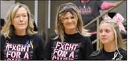 Cheer Coach Patricia Leach (left) continues to wear blue &amp; yellow ribbons in honor of her mom &amp; dad (Bobby &amp; Jackie Leach) and now wears pink for her friend &amp; classmate, Mrs. Jennifer Long ( Photo credit Jaxon Hansard