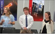 The research and development 2 team, Bree Harle (left), Kennon Lee and Chaska Downs, give their flight profile presentation Oct. 15 for a SystemsGo launch event this spring. Courtesy photo