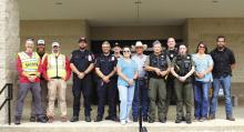 Organized by Chief Deputy Micah Looke (far right) with the Hamilton County Sheriff’s Department, state and local law enforcement, first responders and Hamilton ISD personnel conducted safety training exercises at Hamilton High School last Friday. The joint exercise included Hamilton Emergency Medical Services, Dispatch, HCSO, Texas Game Wardens, Hamilton ISD and representatives from the Texas Education Agency. Photo by Grant Lengefeld