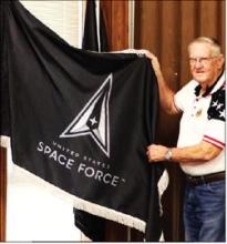 Bob Self, vice commander of Hamilton County American Legion Post 22, presents a U.S. Space Force flag to the Hamilton County Commissioners Court Oct. 13. The flag of the newest military branch will join other patriotic flags displayed in the annex courtroom.