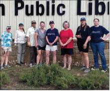Green-thumbed volunteers help with library beds