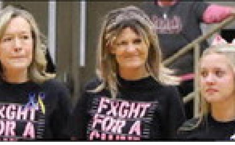 Cheer Coach Patricia Leach (left) continues to wear blue &amp; yellow ribbons in honor of her mom &amp; dad (Bobby &amp; Jackie Leach) and now wears pink for her friend &amp; classmate, Mrs. Jennifer Long ( Photo credit Jaxon Hansard