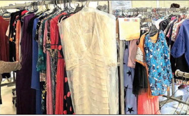 A shopper browses through the packed clothing racks at the well-attended Harvest Fall Festival at the First United Methodist Church Oct. 16-17. Photos by Kate Edwards