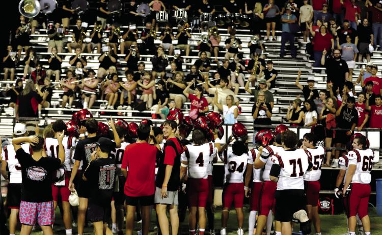 SCHOOL SONG SALUTE: The Bulldogs and their fans raise their finger and sing the school song after traveling to Brady and watching the Hamilton Bulldog football team win 34-17. Photo by Tracy Cox