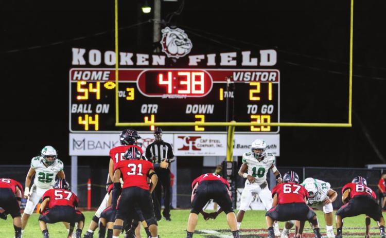 Dogs open district with Itasca after slaying Dragons, 62-21
