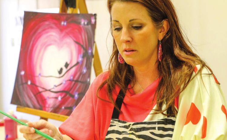 Community center guests get creative on paint day Monday