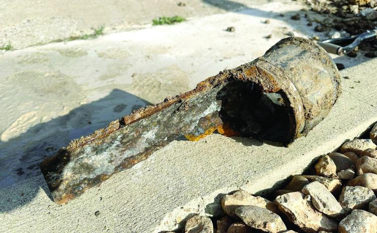 Code officer illustrates pipe deterioration