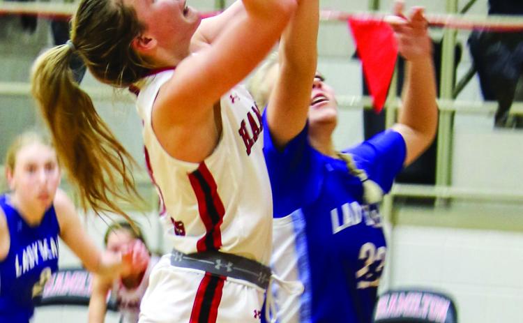 Lady Dogs lead District