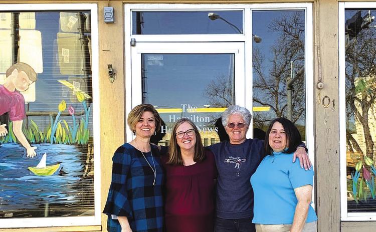 SMILE FOR THE CAMERA: Staff members pose outside the Hamilton Herald-News office on Lonnie Thompson’s last day of work. Pictured left to right are Kym Jeschke, Maria Weaver, Lonnie and Kim Tyson. Courtesy photo