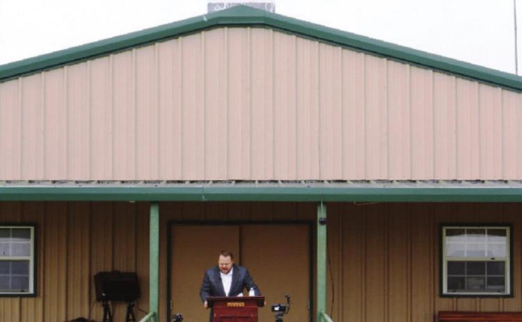 Faith Baptist Church members stayed in their car to listen to Pastor Rob Lowe’s sermon Sunday morning, and will meet that way again this Sunday.