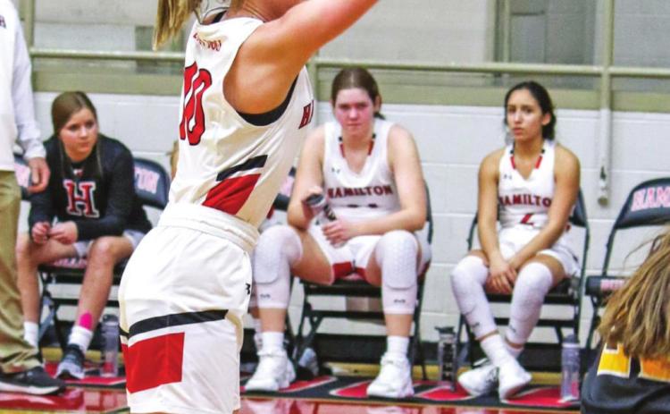 Dogs dunk district win as Lady Dogs shoot for trifecta