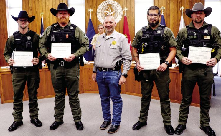 Sheriff honors deputies, court hires bond counsel