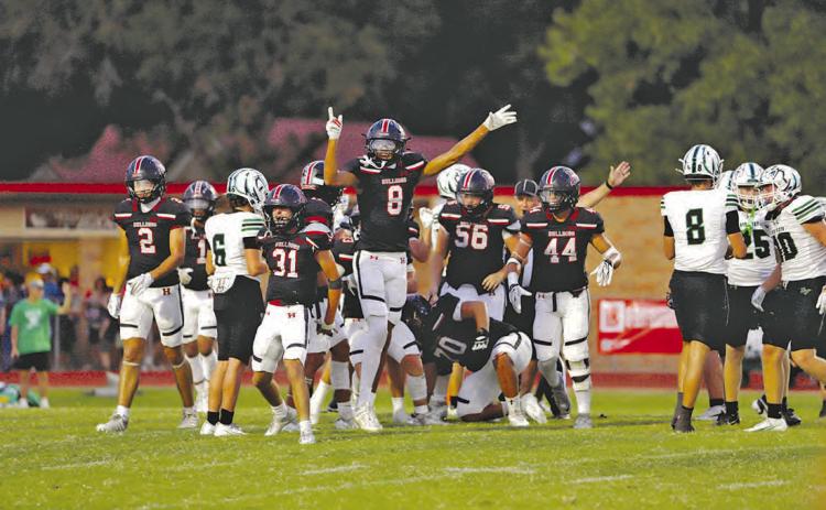 THAT WAY: The Bulldog defense signaling to the crowd and refs that Hamilton has recovered a fumble. Photo by Tracy Cox