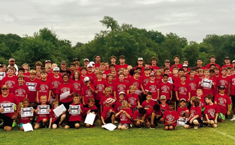 Over 80 incoming first through ninth graders attended Bulldog Football Camp on Monday through Wednesday of last week, jumping at an opportunity to learn from Hamilton’s defending state champion coaching staff and players. Photo by Tracy Cox