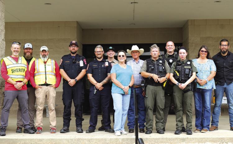 Organized by Chief Deputy Micah Looke (far right) with the Hamilton County Sheriff’s Department, state and local law enforcement, first responders and Hamilton ISD personnel conducted safety training exercises at Hamilton High School last Friday. The joint exercise included Hamilton Emergency Medical Services, Dispatch, HCSO, Texas Game Wardens, Hamilton ISD and representatives from the Texas Education Agency. Photo by Grant Lengefeld