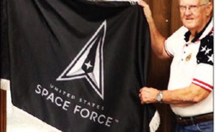 Bob Self, vice commander of Hamilton County American Legion Post 22, presents a U.S. Space Force flag to the Hamilton County Commissioners Court Oct. 13. The flag of the newest military branch will join other patriotic flags displayed in the annex courtroom.