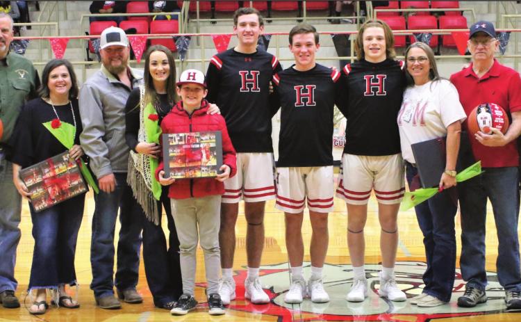 Dogs trip in double OT as Lady Dogs track title scent