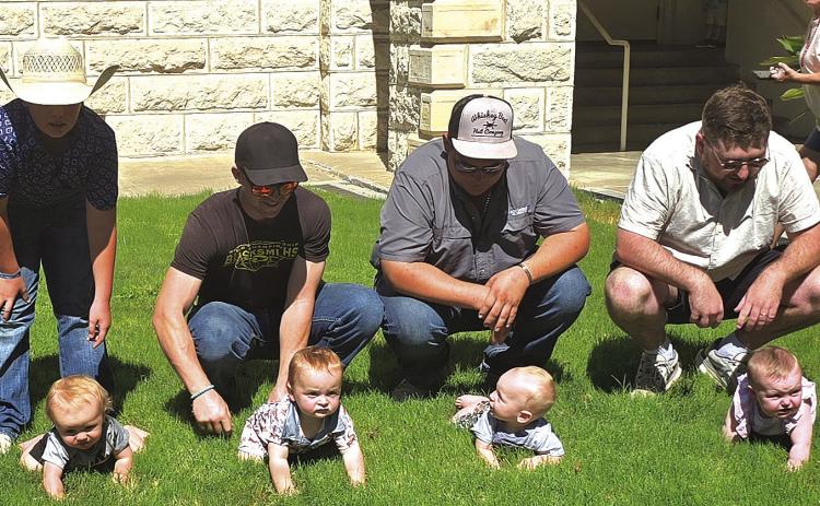 ON YOUR MARKS: Tiny crawlers lined up for this year’s Diaper Dash sponsored by the Miss Hamilton County Dove Festival Pageant Queen’s Court. Photo by Kate Edwards